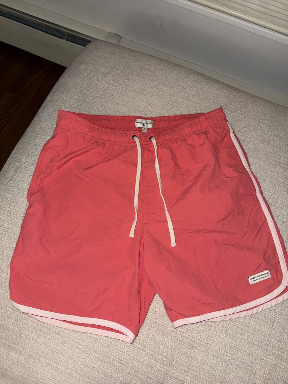 Modern Amusement Coral Swim Trunks with White Trim